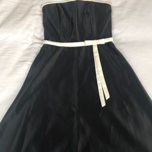 Black A-line dress with white trim